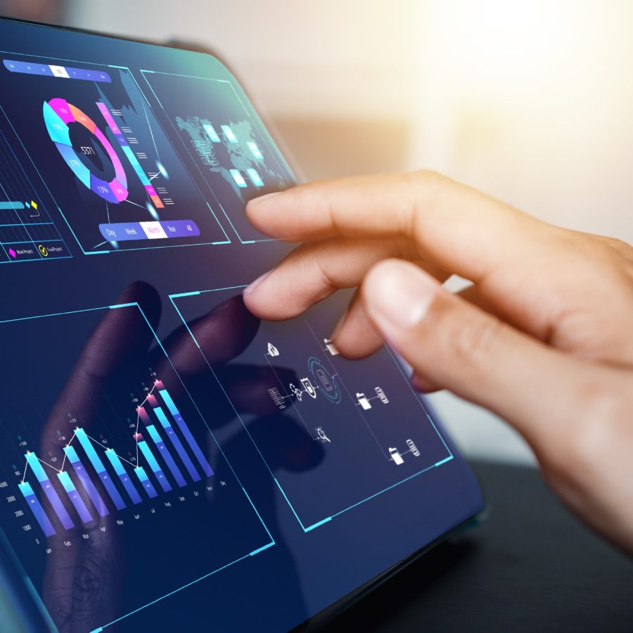 Analyst working with computer in Business Analytics and Data Management System to make report with KPI and metrics connected to database. Corporate strategy for finance, operations, sales, marketing.